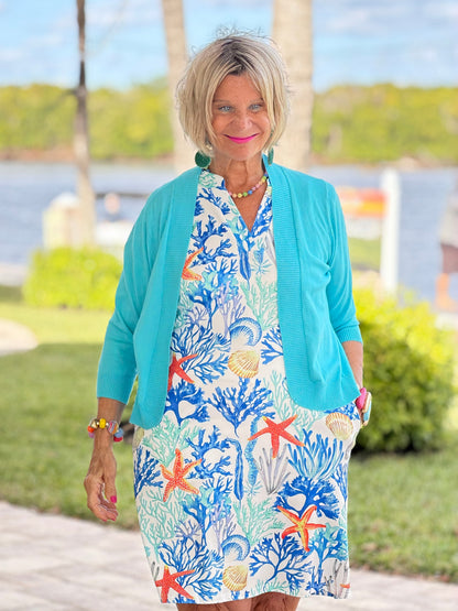 CORAL NOTCH SLEEVELESS UPF + 50 DRESS